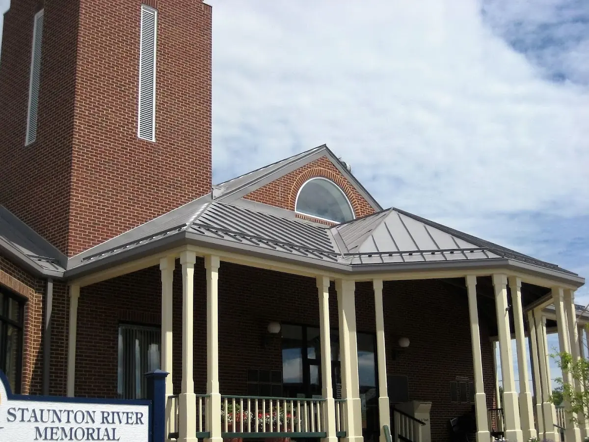 Skilled roofing craftsmen working on a residential roof in Bath